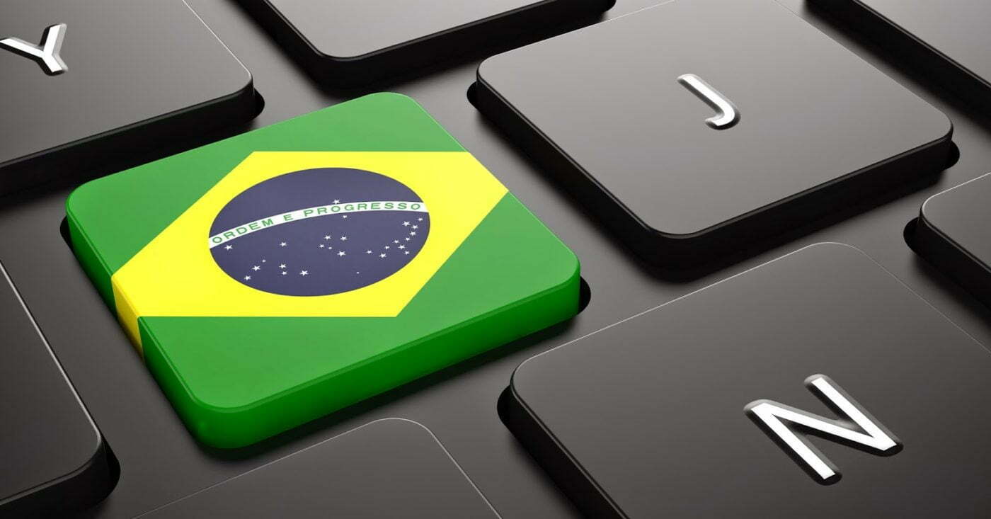 Imagem de teclado com o símbolo da bandeira do Brasil, simbolizando o marco digital que engloba os termos de uso.